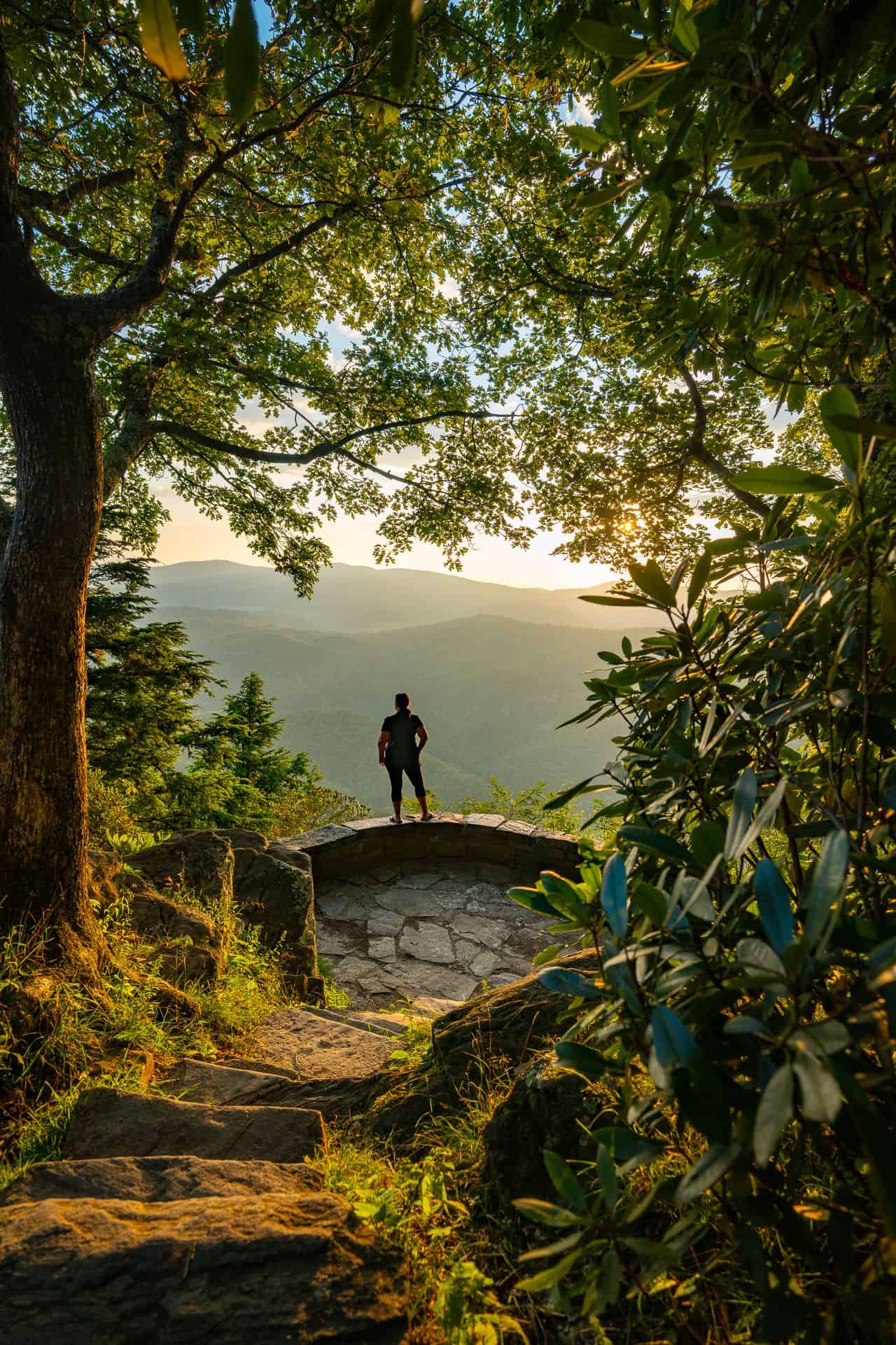 Love to Explore More Sarah Standing looking at mountains